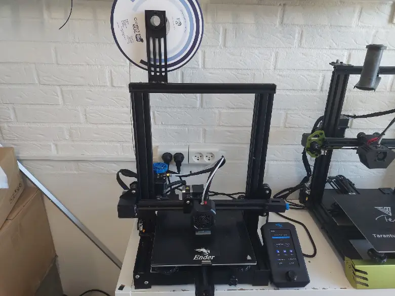 Image showing a Creality Ender 3 printer with grey filament