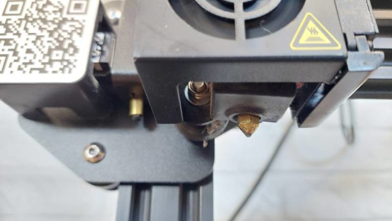 Picture showing a 3D printer nozzle head from an Ender 3 printer
