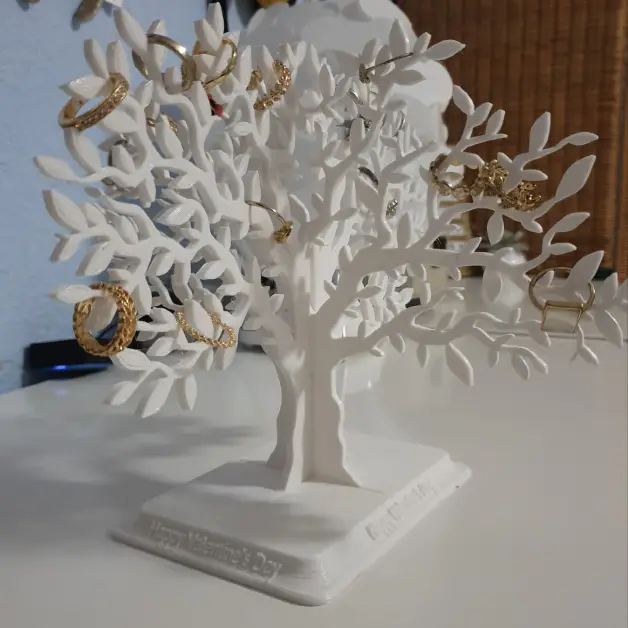 A 3D printed jewelry tree, with a dosen't of rings on it